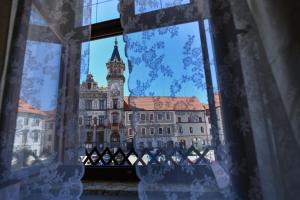 a view of a large building with a clock tower at Bed&Bike Prachatice in Prachatice