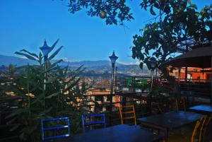 a view of a city from a restaurant with tables and chairs at Cafe Beyond and Guest House in Bhaktapur