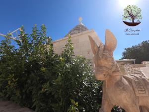 a statue of a rabbit in front of a building at Il Carpino in Martina Franca