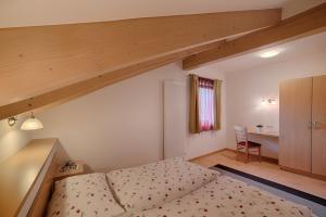 Postel nebo postele na pokoji v ubytování Residence Andrea
