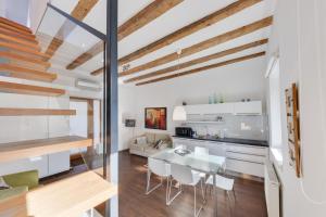 a kitchen and dining room with a table and chairs at Fine Ljubljana Apartments in Ljubljana