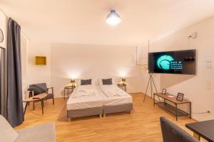 Krevet ili kreveti u jedinici u okviru objekta RHC Central Station Premium Apartments | contactless check-in