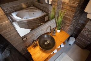 an overhead view of a bathroom with a tub and a sink at Apartment Vila Božena - Tatranská Lomnica in Tatranská Lomnica +12 photos