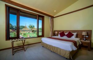 Katil atau katil-katil dalam bilik di Bagan Thiripyitsaya Sanctuary Resort