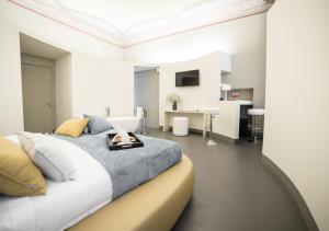 a bedroom with a large bed with a tray on it at LUCUS Exclusive Bed and Breakfast in Lucca