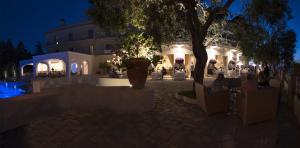 a rendering of a courtyard at night at Grand Hotel Aminta in Sorrento