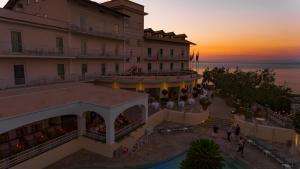 an aerial view of a hotel at sunset at Grand Hotel Aminta in Sorrento