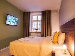 Postel nebo postele na pokoji v ubytování Allure Rooms & Coffee