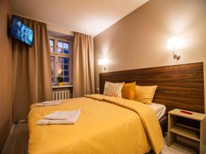 Postel nebo postele na pokoji v ubytování Allure Rooms & Coffee