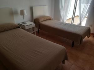 Postel nebo postele na pokoji v ubytování Buganvilla + 29 fotografií