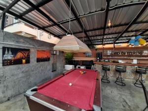 a pool table in a room with a bar at The Villa Residences Resort in Patong Beach