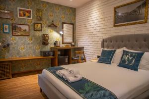 Postel nebo postele na pokoji v ubytování Carnarvon Suites By Reunion