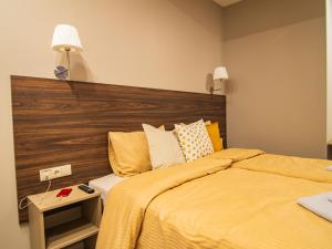 Postel nebo postele na pokoji v ubytování Allure Rooms & Coffee