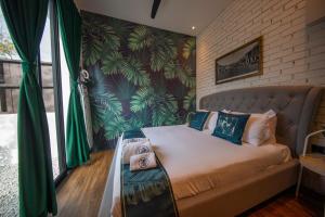Postel nebo postele na pokoji v ubytování Carnarvon Suites By Reunion
