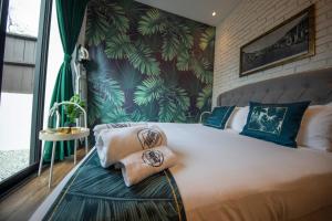 Postel nebo postele na pokoji v ubytování Carnarvon Suites By Reunion