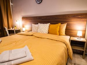 Postel nebo postele na pokoji v ubytování Allure Rooms & Coffee
