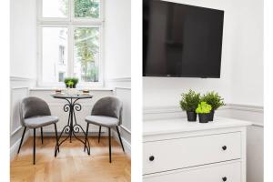 Televízia a/alebo spoločenská miestnosť v ubytovaní HOUSEHOST Apartment I: Studencka Street