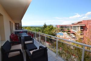 a balcony with chairs and a view of a resort at WVP - Ventura Park Z in Salou