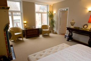 Postel nebo postele na pokoji v ubytování B&B Huis ´T Schaep