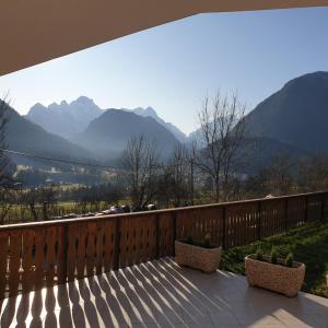 a balcony with a view of the mountains at Apartma Vovk in Mojstrana