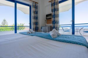 Postel nebo postele na pokoji v ubytování Raffaello Beach