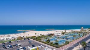 an aerial view of a beach and a parking lot at Marine Heights Suites in Herzliya