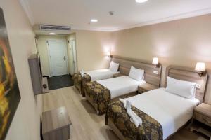 Postel nebo postele na pokoji v ubytování World Point Hotel Besyol