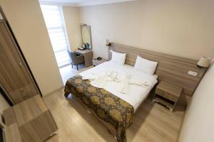 Postel nebo postele na pokoji v ubytování World Point Hotel Besyol