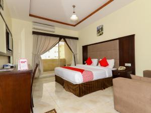 Кровать или кровати в номере OYO 176 Nilufer Al Hada Hotel