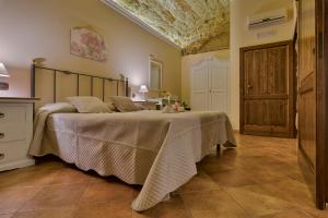 Postel nebo postele na pokoji v ubytování B&B Le Oasi