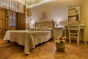 Postel nebo postele na pokoji v ubytování B&B Le Oasi