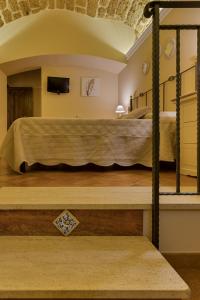 Postel nebo postele na pokoji v ubytování B&B Le Oasi