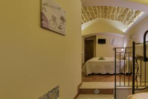 Postel nebo postele na pokoji v ubytování B&B Le Oasi