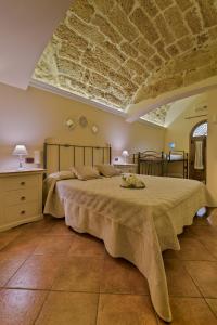Postel nebo postele na pokoji v ubytování B&B Le Oasi