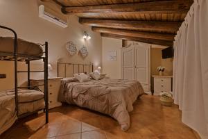 Postel nebo postele na pokoji v ubytování B&B Le Oasi