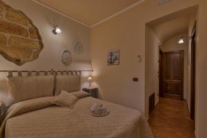 Postel nebo postele na pokoji v ubytování B&B Le Oasi