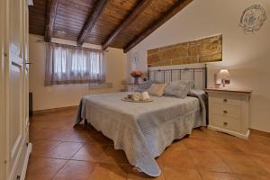 Postel nebo postele na pokoji v ubytování B&B Le Oasi