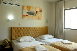 Een bed of bedden in een kamer bij Hotel Pousada Valintur