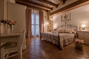 Postel nebo postele na pokoji v ubytování B&B Le Oasi