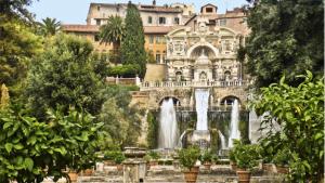 a fountain in front of a building with a waterfall at Altavilla Holiday House in Tivoli