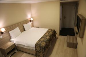 Postel nebo postele na pokoji v ubytování World Point Hotel Besyol