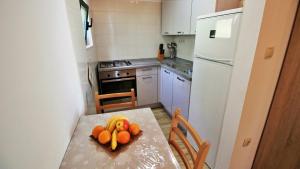 Kuchyň nebo kuchyňský kout v ubytování Holiday Home Jozo