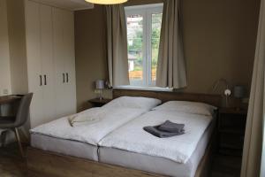 Voodi või voodid majutusasutuse Apartmány LAMA toas
