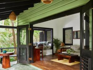 a living room with a green ceiling at GoldenEye in Oracabessa