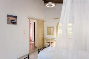 A bed or beds in a room at Stavros Villas&Apartments