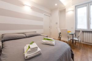 Posteľ alebo postele v izbe v ubytovaní BnButler Friuli, 24 - Porta Romana Apartment