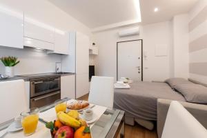Kuchyňa alebo kuchynka v ubytovaní BnButler Friuli, 24 - Porta Romana Apartment