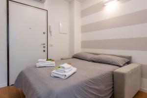 Posteľ alebo postele v izbe v ubytovaní BnButler Friuli, 24 - Porta Romana Apartment