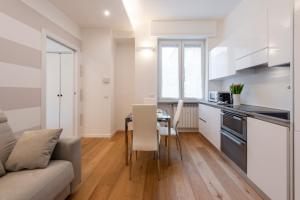 Kuchyňa alebo kuchynka v ubytovaní BnButler Friuli, 24 - Porta Romana Apartment