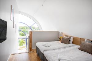 Postel nebo postele na pokoji v ubytování Hotel Arkaden